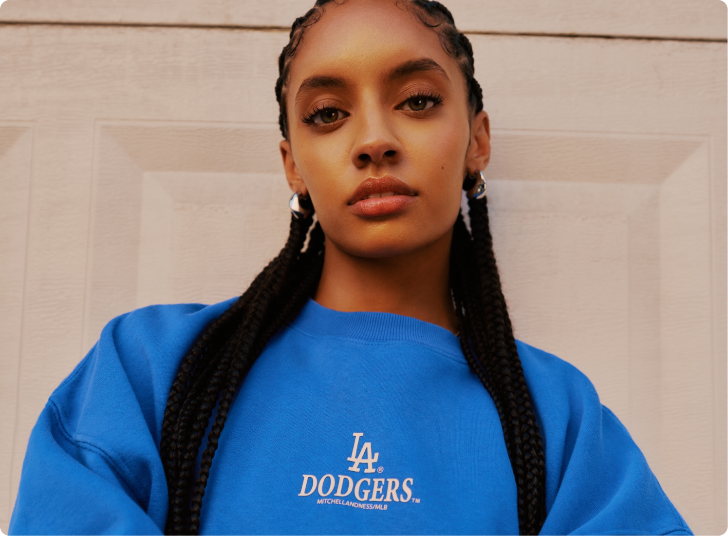 Model wearing a blue Los Angeles Dodgers crewneck.
