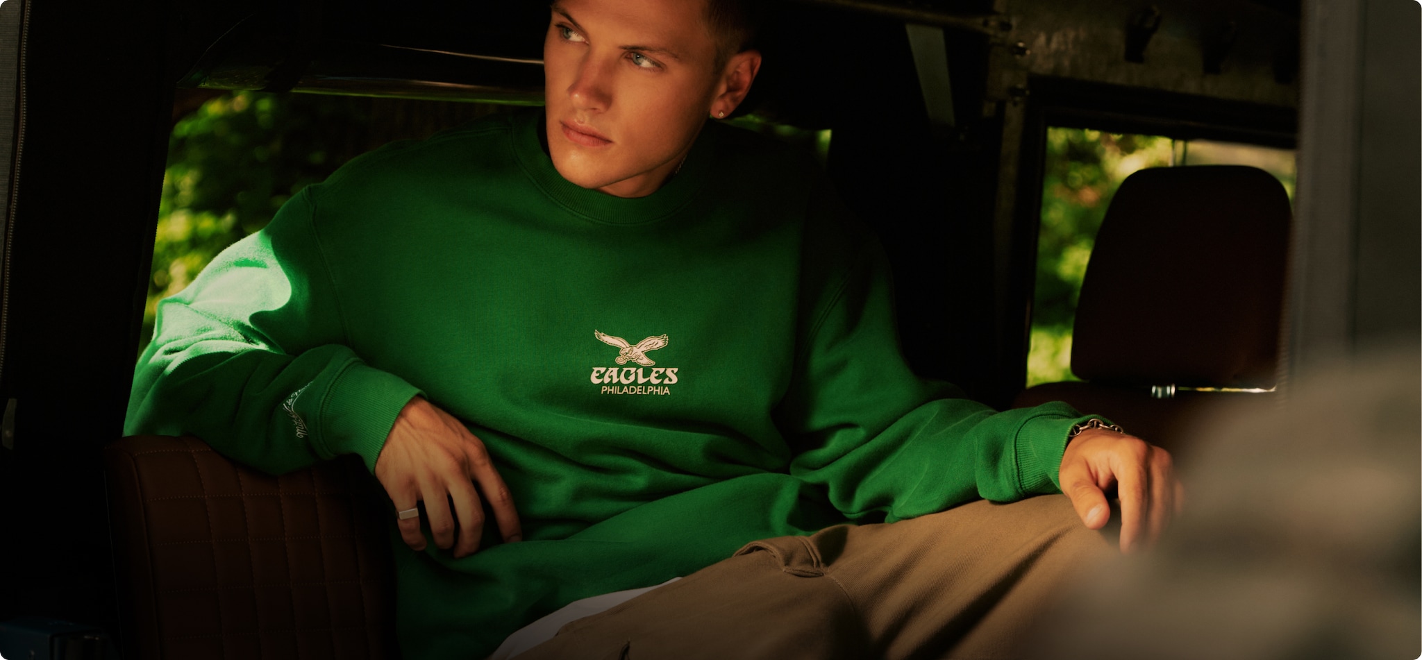 Model wearing a Philadelphia Eagles crewneck.